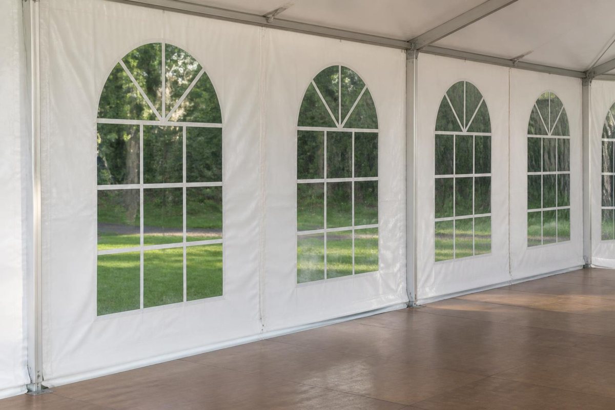 Tent window sidewalls beside a finished event floor