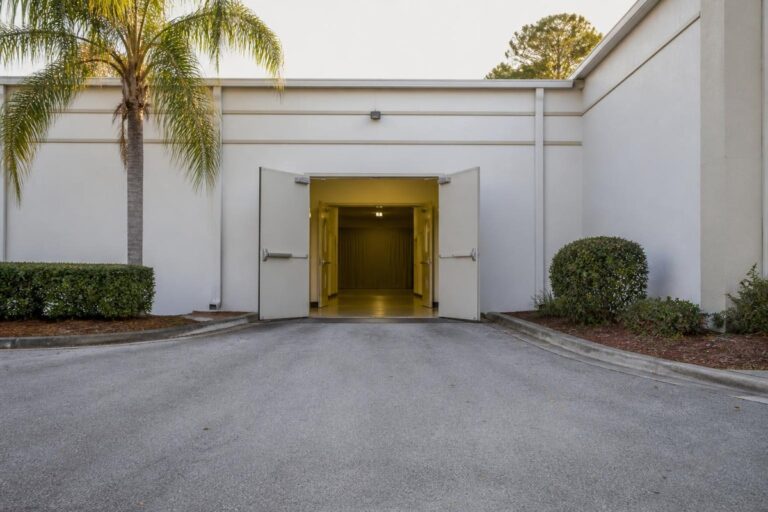 Open venue service doors reached by a level paved route