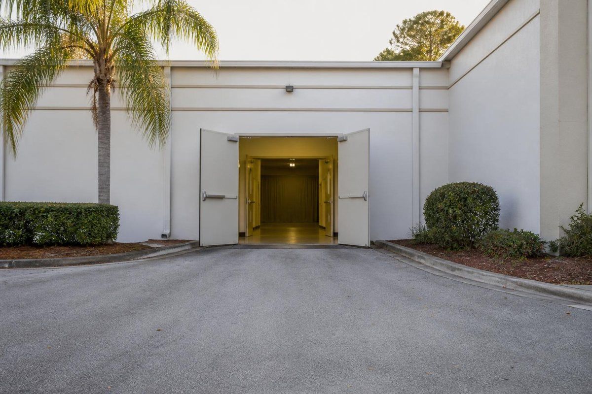 Open venue service doors reached by a level paved route