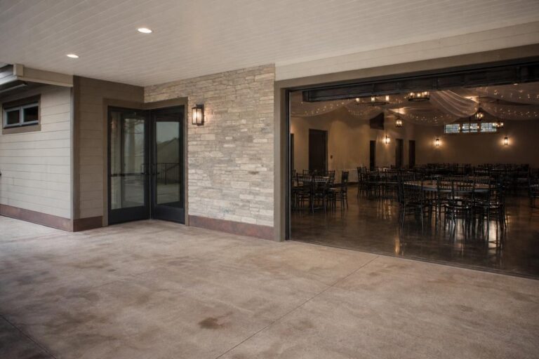 Covered venue entrance beside indoor seating