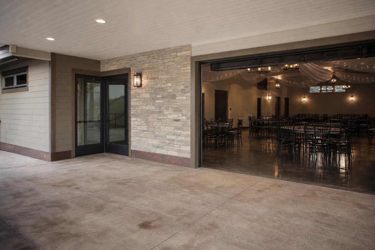 Covered venue entrance beside indoor seating